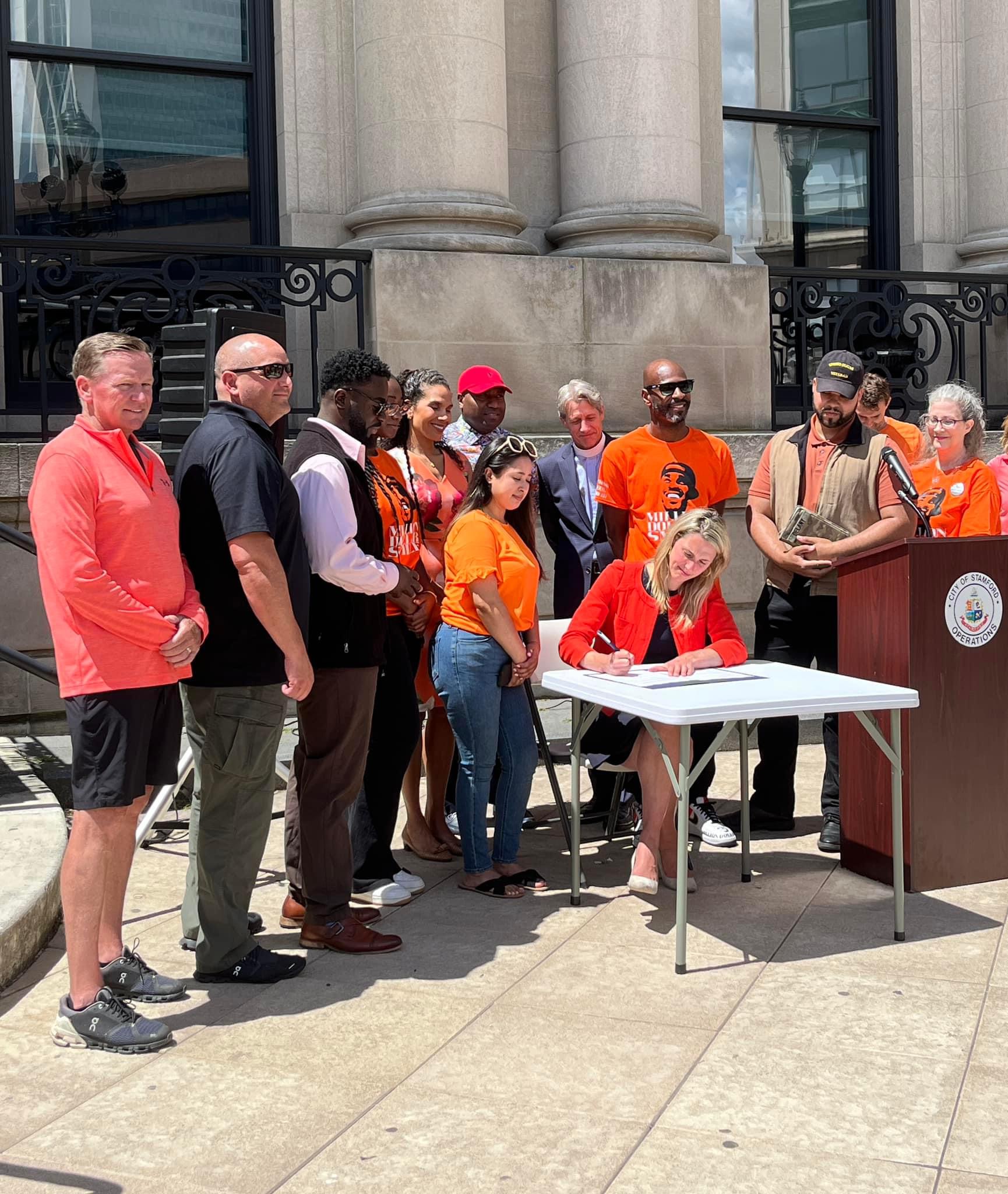 Mayor Simmons sits with community activists at Gun Violence Awarness Month