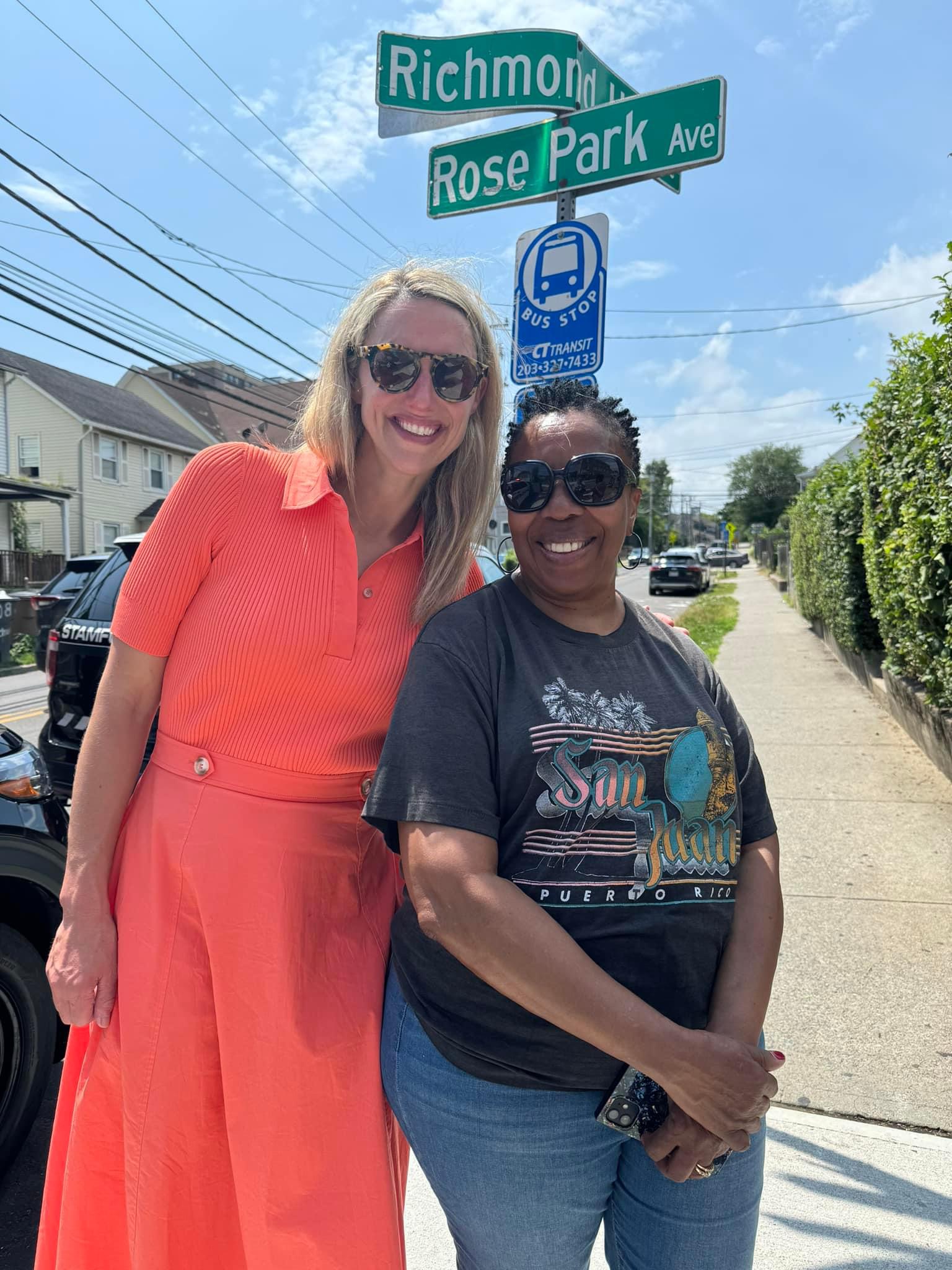 Mayor Simmons smiles with a resident on the West Side