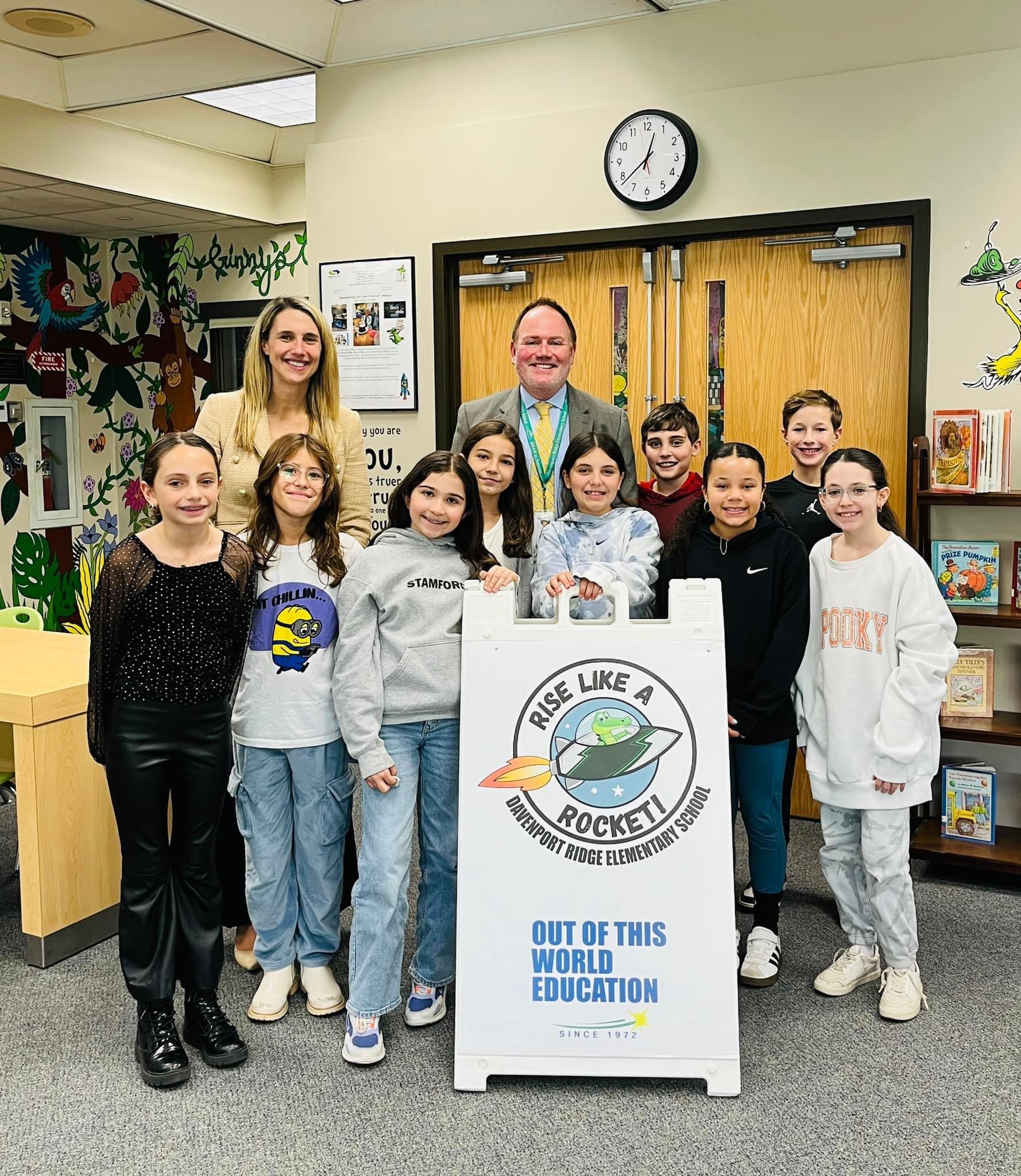 Mayor Simmons smiles with members of the Davenport Elementary 5th grade student council